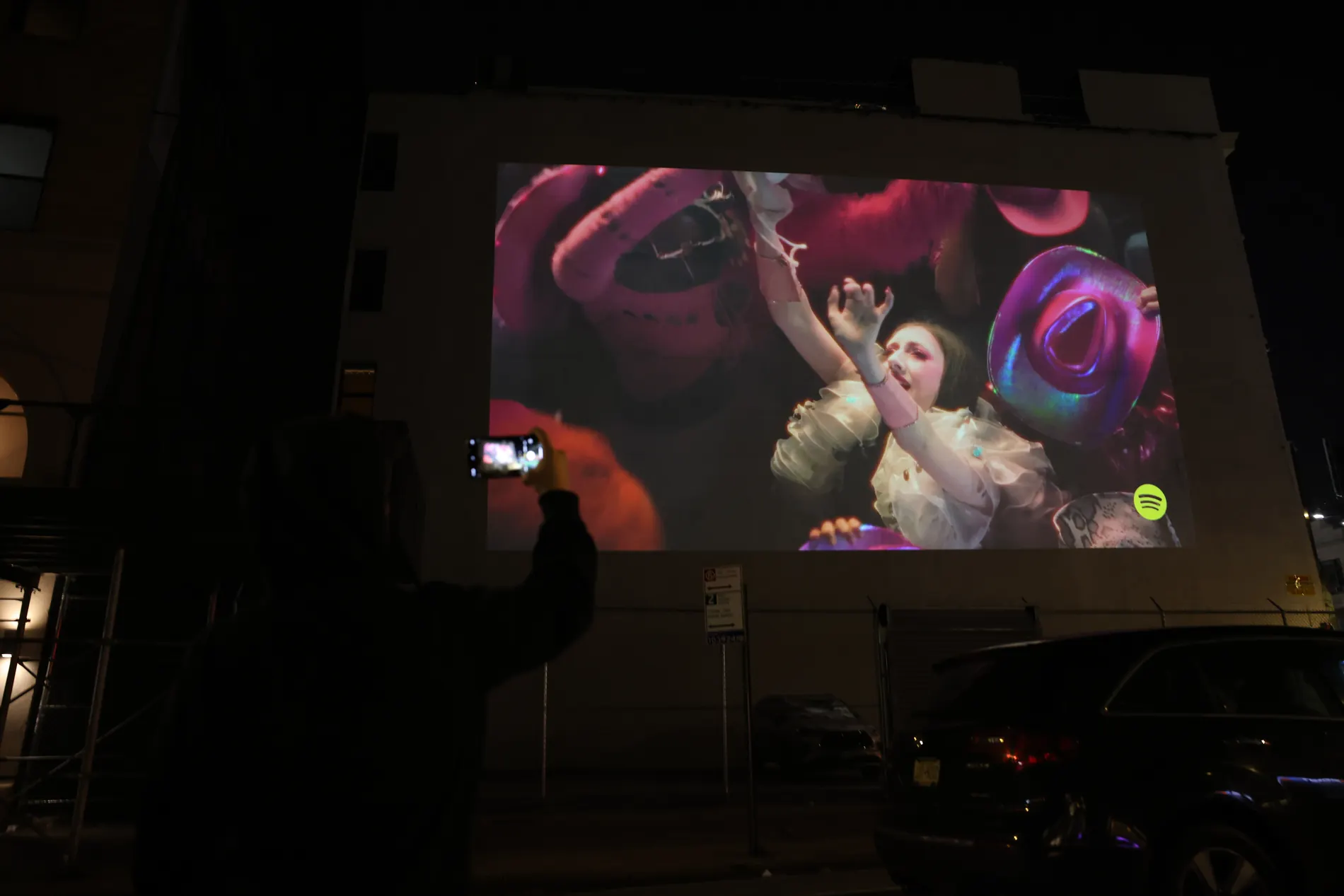 Projection advertising visible at night in the city