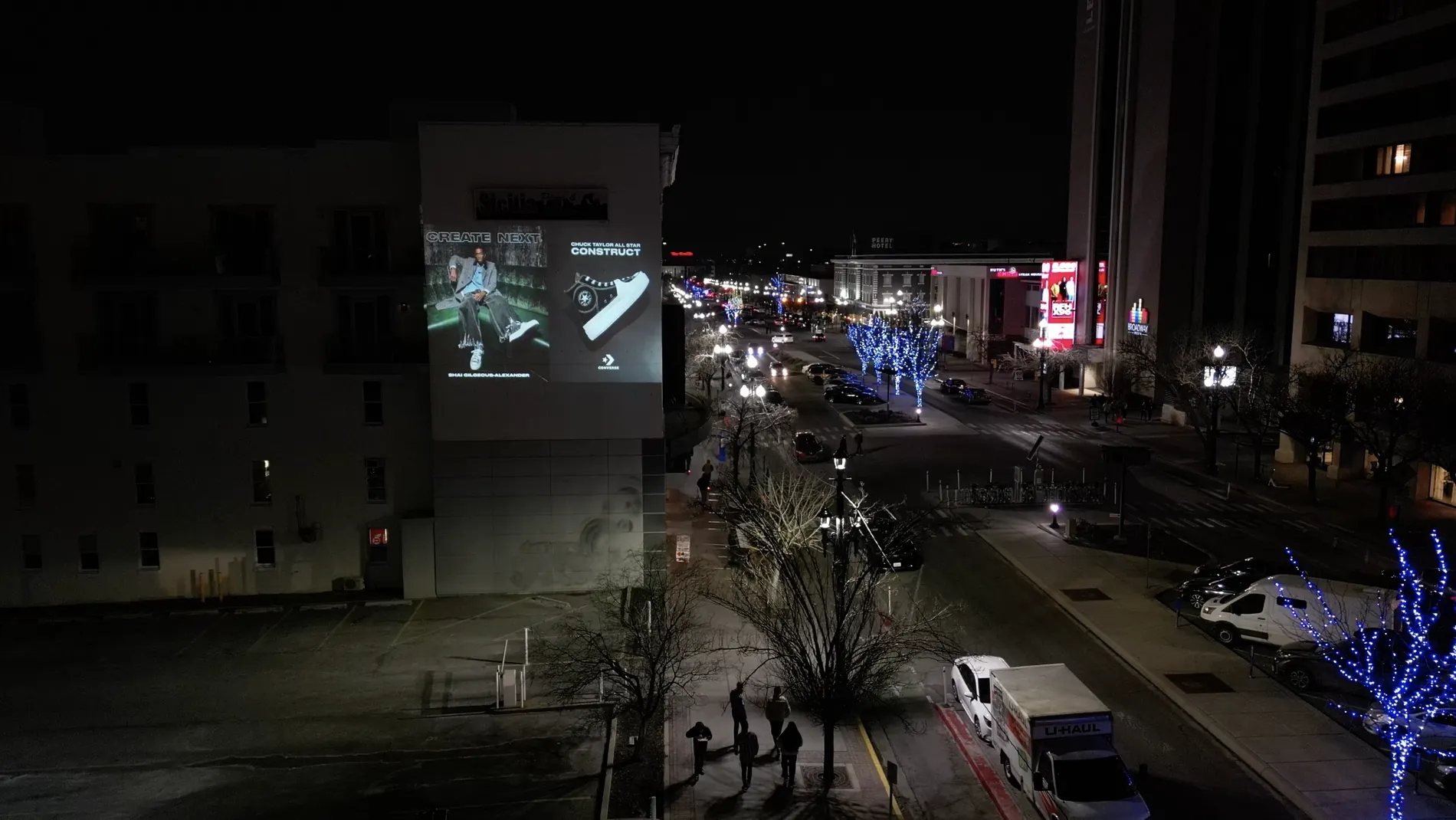 Large projection advertising visible from a city street