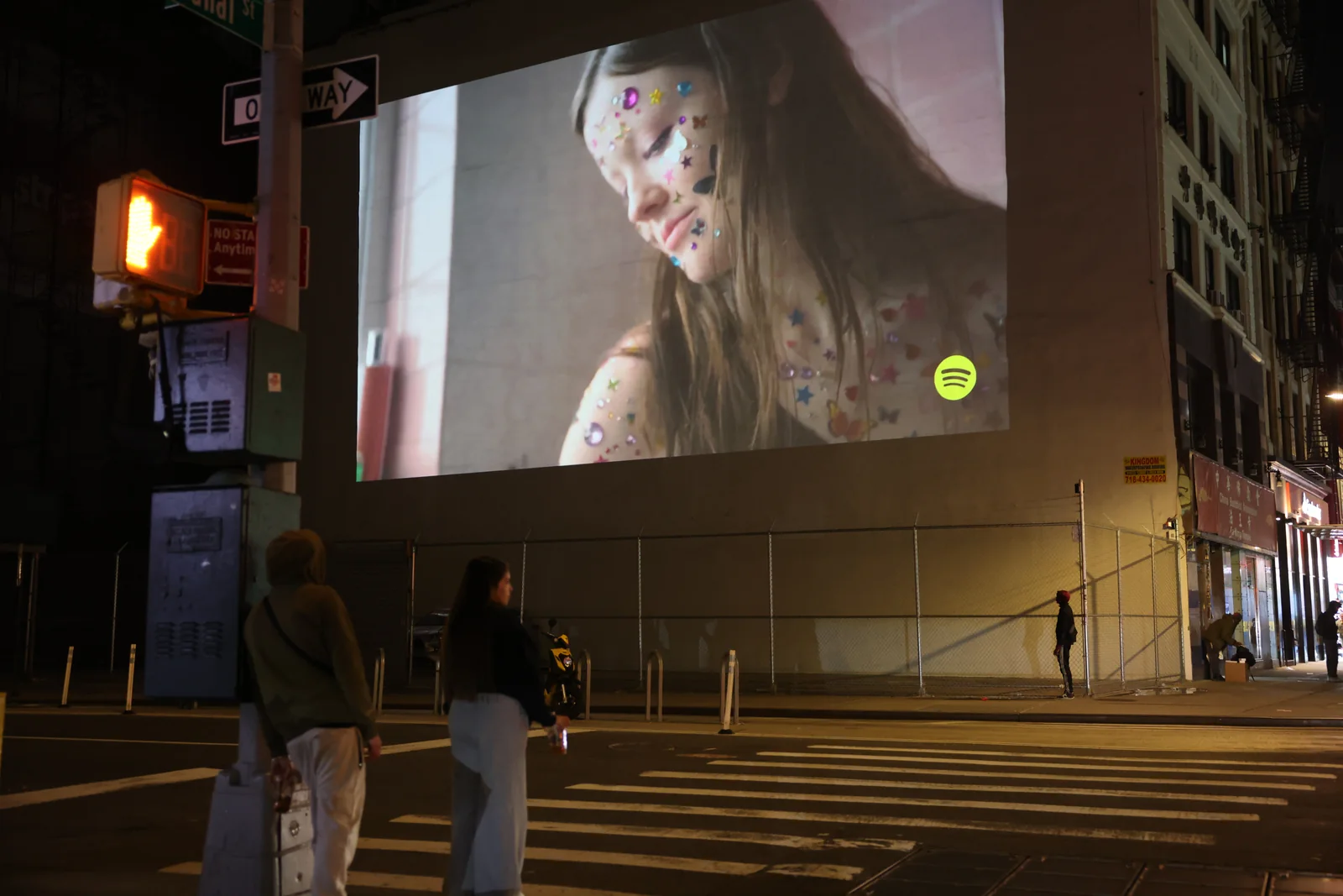 Projection advertising viewed from a city crosswalk