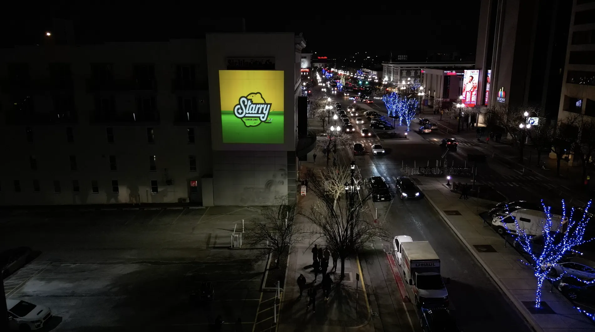 Projection campaign in a city corridor with night traffic